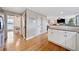 Kitchen with breakfast bar, hardwood floors, and view into dining area at 3025 Lexington Ave, Woodstock, GA 30189