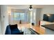 Bright living room with hardwood floors, comfy sofa, and access to balcony at 1005 Chastain Park Ne Ct # 1005, Atlanta, GA 30342