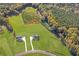Aerial view of two homes in a rural setting with green space at 106 Red Oak Ln, Carrollton, GA 30116