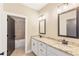 Double vanity bathroom with granite countertop and tiled shower at 106 Red Oak Ln, Carrollton, GA 30116