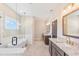 Main bathroom with double vanity, soaking tub, and separate shower at 106 Red Oak Ln, Carrollton, GA 30116