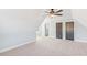 Large bedroom with carpeted floor, ceiling fan, and two closets at 106 Red Oak Ln, Carrollton, GA 30116
