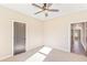 Spacious bedroom with carpet flooring and doors to hallway at 106 Red Oak Ln, Carrollton, GA 30116