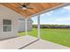 Relaxing covered patio with wood ceiling and view of the backyard at 106 Red Oak Ln, Carrollton, GA 30116