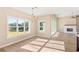 Bright dining area with large window and chandelier overlooking the backyard at 106 Red Oak Ln, Carrollton, GA 30116