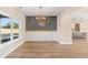 Dining room features wood-look floors, accent wall, chandelier at 106 Red Oak Ln, Carrollton, GA 30116