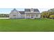 Two-story farmhouse with gray siding and a large front yard at 106 Red Oak Ln, Carrollton, GA 30116