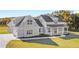Gray farmhouse exterior with a large front porch and attached garage at 106 Red Oak Ln, Carrollton, GA 30116