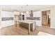 Spacious kitchen with large island, white cabinets and herringbone tile backsplash at 106 Red Oak Ln, Carrollton, GA 30116