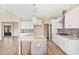 Modern kitchen boasts white cabinets, granite countertops and gold accents at 106 Red Oak Ln, Carrollton, GA 30116