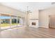 Living room features fireplace, sliding doors to patio, wood-look floors at 106 Red Oak Ln, Carrollton, GA 30116