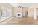 Bright living room featuring a fireplace and sliding glass doors leading to a patio at 106 Red Oak Ln, Carrollton, GA 30116