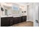 Double vanity bathroom with dark brown cabinets and a window at 467 Daffodil Lane Ln, Mcdonough, GA 30253