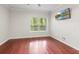 Bedroom with hardwood floors and a wall-mounted TV at 2103 River Green Nw Dr, Atlanta, GA 30327