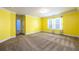 Bright bedroom with yellow walls and neutral carpeting at 2910 Blake Towers Ln, Buford, GA 30519