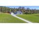 Aerial view of a two-story house with detached garage and expansive lawn at 101 Red Oak Ln, Carrollton, GA 30116