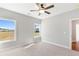 Well-lit bedroom with two windows and ceiling fan at 101 Red Oak Ln, Carrollton, GA 30116