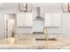 Modern kitchen with white cabinets, granite countertops and gold faucet at 101 Red Oak Ln, Carrollton, GA 30116