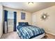 Relaxing bedroom with blue and white bedding, a window with curtains, and tasteful decor at 132 Eagle Rock Dr, Acworth, GA 30101