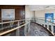 Modern hallway with glass railings and artwork at 3344 Peachtree Ne Rd # 3703, Atlanta, GA 30326