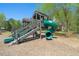 Community playground with wooden playset and slide at 67 Rocking Wood Vw, Dallas, GA 30157