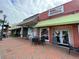 Brick-paved street with shops and restaurants, showing local businesses at 67 Rocking Wood Vw, Dallas, GA 30157