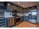 Modern gray kitchen with stainless steel appliances at 215 Piedmont Ne Ave # 804, Atlanta, GA 30308