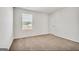 Bright bedroom with neutral walls and carpet at 620 Egrets Landing Lot #68, Covington, GA 30014