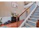 Elegant staircase with iron railings, hardwood floors at 2384 Allsborough Way, Dacula, GA 30019