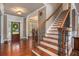 Elegant entryway with hardwood floors, a staircase, and high ceilings at 552 Grassmeade Way, Snellville, GA 30078