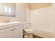 Clean bathroom with white vanity, tub, and tiled surround at 1841 Northwick Pl, Lithonia, GA 30058