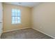 Well-lit bedroom with neutral walls and carpet flooring at 1841 Northwick Pl, Lithonia, GA 30058