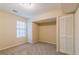 Cozy bedroom with carpet, window, and built-in closets at 1841 Northwick Pl, Lithonia, GA 30058