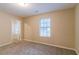 Simple bedroom with neutral walls and carpeted floor at 1841 Northwick Pl, Lithonia, GA 30058
