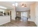 Open dining room with wood-look floors and access to a deck at 1841 Northwick Pl, Lithonia, GA 30058