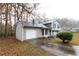 Front view of the house, showing the garage and driveway at 1841 Northwick Pl, Lithonia, GA 30058