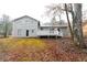 Back of house with deck and wooded backyard at 1841 Northwick Pl, Lithonia, GA 30058