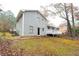 View of the back of house, deck, and yard at 1841 Northwick Pl, Lithonia, GA 30058