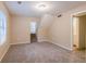 Living room with carpeted floors and access to upstairs at 1841 Northwick Pl, Lithonia, GA 30058