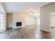 Spacious living room with a fireplace and wood-look floors at 1841 Northwick Pl, Lithonia, GA 30058