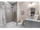 Spa-like bathroom with gray tile, soaking tub, and modern vanity at 1130 Lupo Loop, Chattahoochee Hills, GA 30268