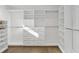 Bright white closet with custom built-in shelving at 436 Valley Brook Ne Dr, Atlanta, GA 30342