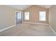 Bright bedroom with vaulted ceiling, carpet flooring, and sliding glass doors at 2820 Quarters Ln, Powder Springs, GA 30127