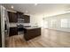 Modern kitchen with dark cabinets, granite countertops, and stainless steel appliances at 4940 Elm Brook Dr, Atlanta, GA 30349