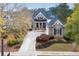 Luxury brick home with metal roof and landscaping at 6191 Talmadge Run, Acworth, GA 30101