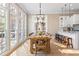 Bright dining room with farmhouse table and access to kitchen at 6191 Talmadge Run, Acworth, GA 30101