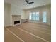 Spacious living room with a stone fireplace and built-in cabinets at 211 Iroquois Ct, Covington, GA 30014