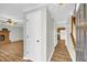 Bright entryway with wood flooring, white door, and view into living room at 2701 Treehouse Ln, Lawrenceville, GA 30044