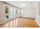 Sunlit living room with hardwood floors and entryway view at 1540 Woodcreek Dr, Cumming, GA 30041