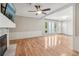 Open living room featuring hardwood floors and a fireplace at 1540 Woodcreek Dr, Cumming, GA 30041